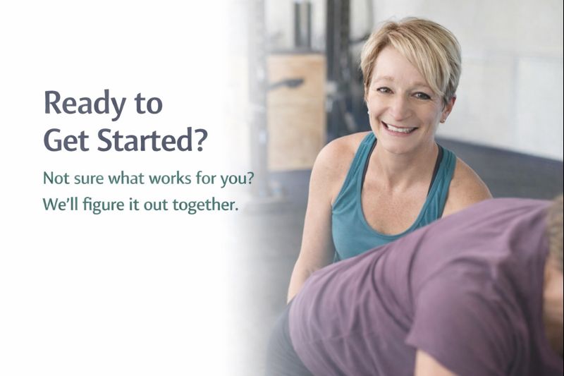 Fitness coach offering guidance in gym